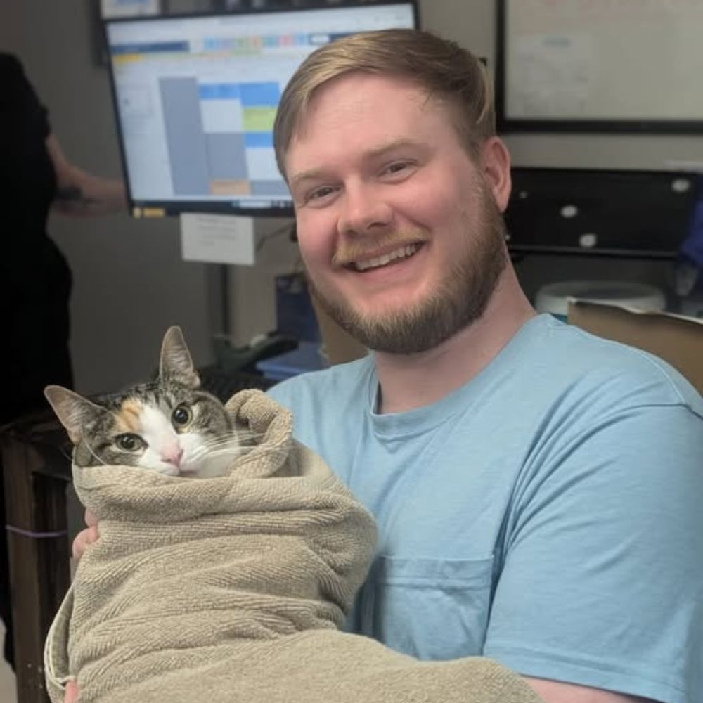 A vet holding a dog